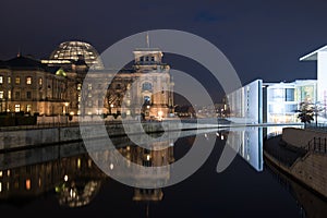 Berlin Spreebogen and Reichstag at night