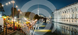 Berlin Strandbar party at Spree river with TV tower at night, Germany