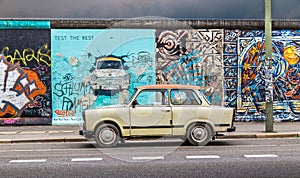 Berlin Wall at East Side Gallery with an old Trabant, Germany