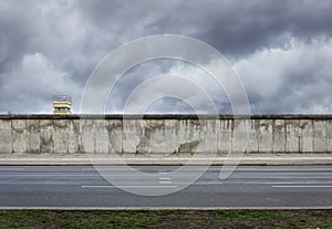 Berlin Wall with watchtower from the time of the Cold War photo