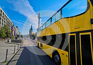 Berlin yellow tourist bus near Berliner Dom