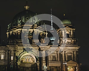 Berliner dom with Tv tower in Berlin at night. Berlin tourism and travel concept. Night cityscape of Berlin