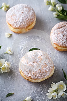 Berliner donuts in powdered sugar