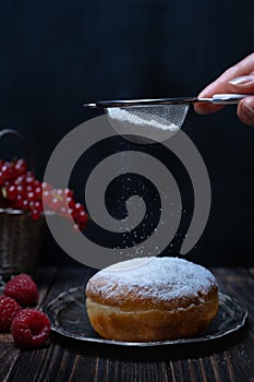 Berliner jelly filled doughnut with raspberry and redcurrant.