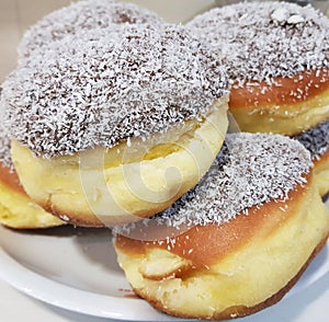 a berliner with sugar on a plate