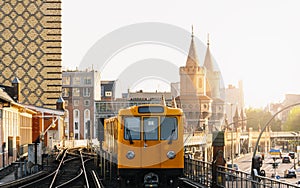 Berliner U-Bahn with Oberbaum Bridge in the background in golden evening light at sunset, , Capital of Germany