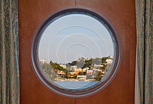 Bermuda coastline seen through a cruise ship porthole