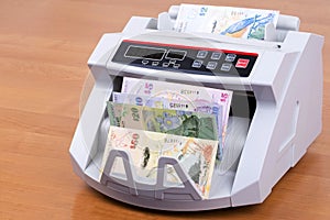 Bermudian Dollar in a counting machine