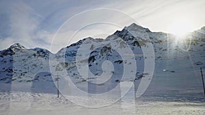 The Bernina Express Red Train passing through the Alps