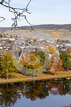 Bernkastel-Kues and the river Moselle in autumn with multi colored trees