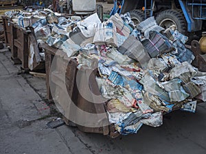 Beroun, Czech Republic, March 23, 2019: old rusty container full of stack waste paper for recycling