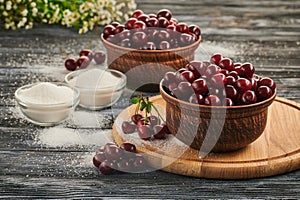 berries in bowls, ripe cherries in the plates