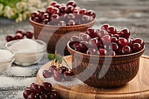 berries in bowls, ripe cherries in the plates