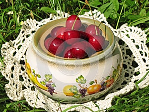 Berries cherries in a ceramic pot