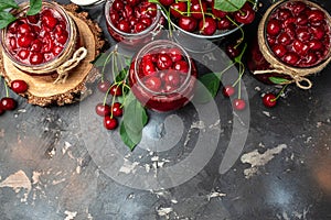 Berries cherry with syrup. Berries cherry with syrup. Canned fruit on a dark background. Long banner format. place for text, top