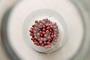 Berries in a glass jar of compote. Harvest. Blueberries, red currants and cherries