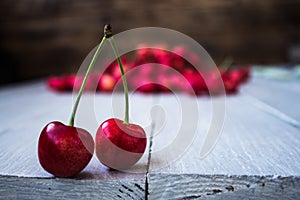 Berries of light cherry on a wooden background