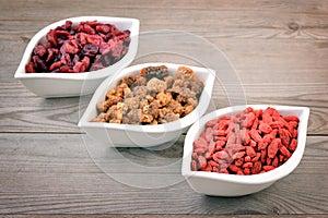 Berries on old wooden background.