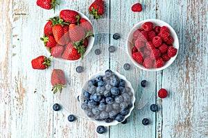 Berries, summer fruits on a wooden table. Healthy lifestyle concept. Selective focus