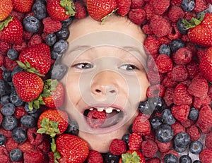 Berry banner. Kids face with berries mix of strawberry, blueberry, raspberry, blackberry.