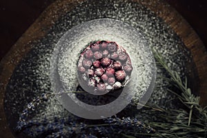 Berry cake with lavender on the wood table
