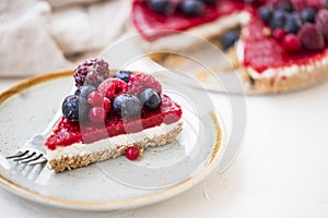 Berry cheesecake slice, fresh frozen red fruits and cheese cake slice