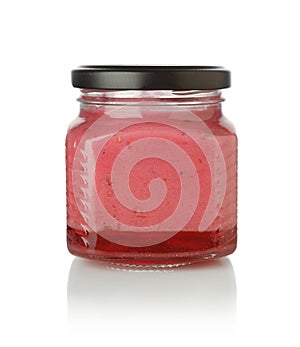 Berry dessert in a glass jar isolated