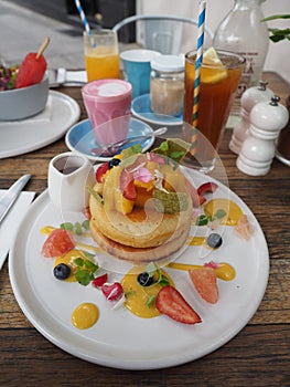 Berry Hotcakes, Iced Lemon Tea, and Beetroots Latte photo