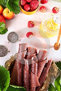 Berry marshmallow with strawberries and chia seeds on a white background. Honey and chia seeds on a light background. Honey stick