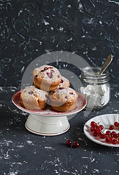Berry muffins on a dark background.