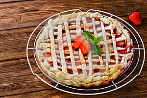 Berry pie. Strawberry tart on rustic wooden table