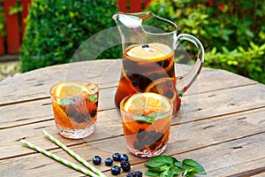 Berry sangria - summer cocktail, decorated with berries, orange