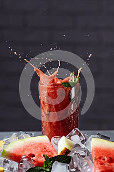 Berry smoothie with falling slices of fruit