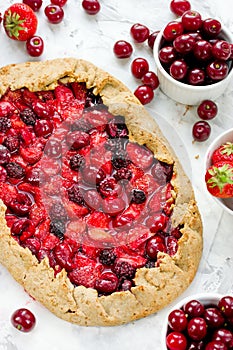 Berry Tart. Dietary rye galeta with summer berries. Pie with strawberry, cherry and blackberry