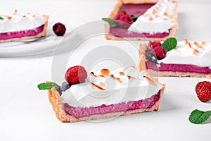Berry tart topped with torched meringue