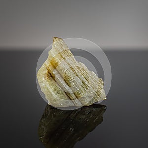 Beryl mineral crystal on a dark background.