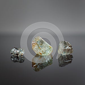Beryl mineral crystal on a dark background.