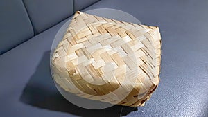 A besek made of bamboo is traditionally made which is used as a container