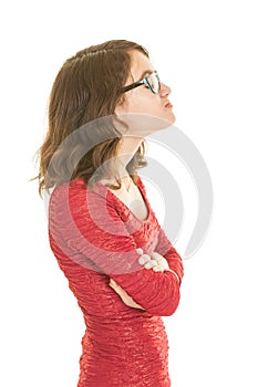 Bespectacled teenage girl in red dress pouting