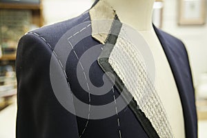 A bespoke suit on a mannequin photo