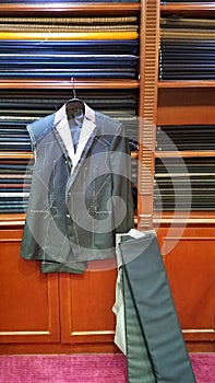 Bespoke suit under construction at upscale tailor photo