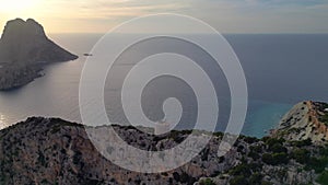 Best aerial top view flight drone Sunset cliff Ibiza pirates island tower Spain