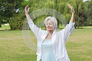 Best ager women practising yoga ant tai chi photo
