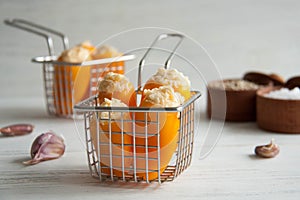 Mini orange peppers stuffed with cheese and garlic