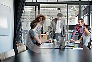 The best brains in the business. Shot of office workers in a meeting in a boardroom.