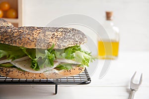 Bagel with chicken roll, green salad and cream cheese