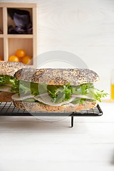 Bagel with chicken roll, green salad and cream cheese