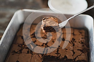 Best brownies dessert in a cake pan. High angle view of freshly baked brownies. Delicious chocolate cake
