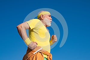 Best cardio workout. The old and young sportsmen running on the road. Portrait of healthy senior sport man. Summer and