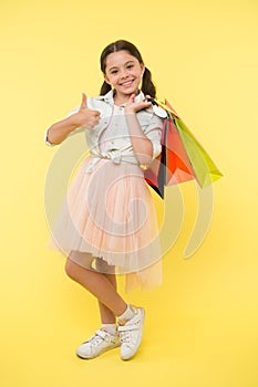 Best discounts and promo codes. Girl carries shopping bags. Back to school season great time to teach budgeting basics